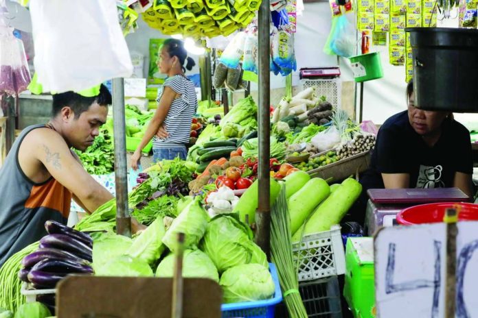 July_inflation_compressed_resized Fresh vegetables are for sale at a market in Tondo, Manila. Lower food, fuel and housing costs helped slow headline inflation to 6.2 percent in July, signaling an easing of price pressures, according to government data. PNA