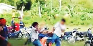 A screenshot from a video shows the 16-year-old Grade 11 student being allegedly assaulted by a group of men outside a high school in La Castellana, Negros Occidental on July 29. Police said the suspects, who were reportedly not students of the school, allegedly mistook the victim for another person linked to a conflict between two groups. GMA REGIONAL TV PHOTO