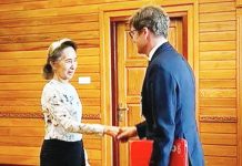 Suu Kyi appears healthy in first outside contact for 2.5 years Former Myanmar president Aung San Suu Kyi shakes hands with Arnaud de Baecque, resident representative of the International Committee of the Red Cross. Suu Kyi's son has mounted an international campaign demanding proof of life for the detained democracy icon. MYANMAR MILITARY INFORMATION COMMITTEE