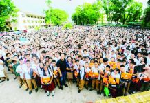 A total of 9,136 students of Negros Occidental High School (NOHS) proudly hold the school bags and basic school supplies they received from the Bacolod City Government during the distribution on August 17. BCCO PHOTO