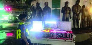 A coffin with an ant-China slogan is seen at the Boy Scout Circle along Timog Avenue in Quezon City. INQUIRER/NET