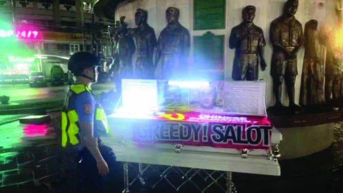 Nation anti-China copy_compressed A coffin with an ant-China slogan is seen at the Boy Scout Circle along Timog Avenue in Quezon City. INQUIRER/NET