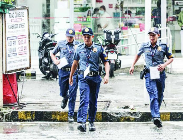 Nation_PNP_copy_compressed_resized Work continues for police officers amid continuous rains in Quezon City. A weather system in the vicinity of Quezon province is bringing cloudy skies with scattered rains and thunderstorms over Metor Manila and parts of Luzon, according to the state weather bureau. PNA