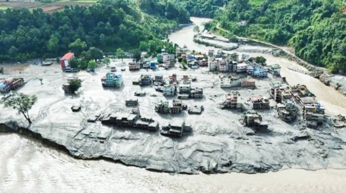 This aerial shot shows the destruction caused by raging floodwaters and a mudslide that hit a village along the Nepal-Tibet border. REUTERS
