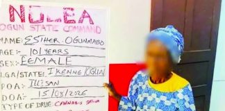 The 101-year-old Nigerian Esther Ogunmabo is photographed alongside her offence board after she was arrested for selling cannabis. Ogunmabo said she started selling illicit drugs after her shop was destroyed in a fire. NDLEA