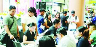 Applicants line up for screening and on-the-spot interviews during a local recruitment activity in Iloilo City. The job fair brought together employers and job seekers as part of efforts to expand employment opportunities amid improving labor market conditions.
