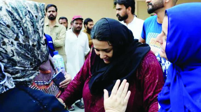 A mother of a newborn victim is consoled following a deadly fire at the Pakistan Institute of Medical Sciences (PIMS) hospital in Islamabad, Pakistan on August 26, 2026. REUTERS