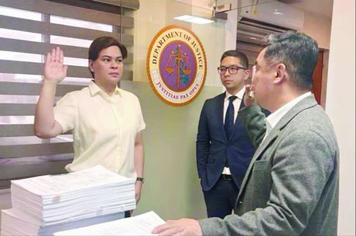 Sara_Madriaga_copy_compressed_resized Vice President Sara Duterte-Carpio has filed another perjury complaint against Ramil Madriaga who claimed to be her former bagman before the Taguig City Prosecutor's Office Monday, August 17. In the materials released by the Office of the Vice President, Duterte-Carpio can be seen taking her oath and was accompanied by her legal counsel, Atty. Paolo Panelo.