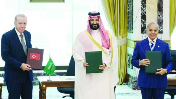 Saudi_compressed_resized Turkish President Tayyip Erdogan, Saudi Crown Prince Mohammed bin Salman and Pakistan's Prime Minister Shehbaz Sharif pose after signing a joint defenSe agreement in Mecca, Saudi Arabia. REUTERS