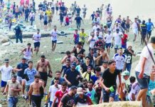 Spain’s Prime Minister blames traffickers after 60,000 migrants reach Ceuta from Morocco Young migrant men from Morocco are seen emerging from the waters to reach Ceuta, a Spanish territory in North Africa. They want to enter Europe. BBC