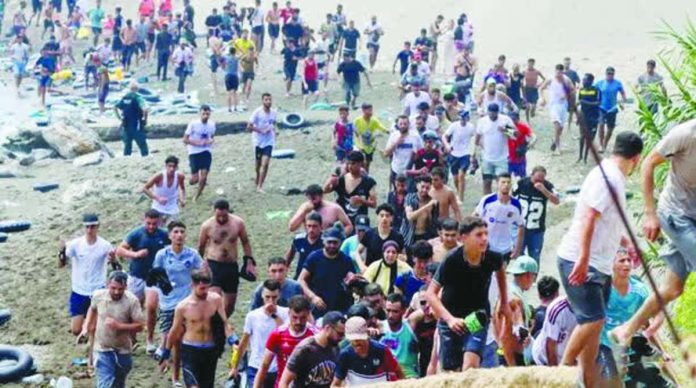 Spain_copy_compressed_resized Young migrant men from Morocco are seen emerging from the waters to reach Ceuta, a Spanish territory in North Africa. They want to enter Europe. BBC