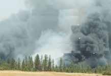 Washington state wildfires force 60,000 people to evacuate homes Thick smoke rises from this field in Washington state.