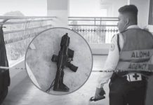 Academic pressure eyed in Ateneo Zamboanga shooting A school security guard walks through a cordoned-off area at Ateneo de Zamboanga University following Tuesday’s deadly campus shooting. Inset shows one of the firearms recovered in connection with the attack, which left two students dead, including the student-gunman himself.