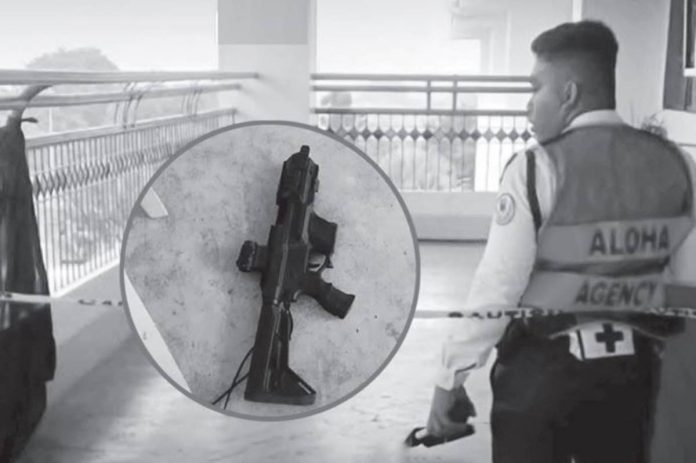 academic pressure A school security guard walks through a cordoned-off area at Ateneo de Zamboanga University following Tuesday’s deadly campus shooting. Inset shows one of the firearms recovered in connection with the attack, which left two students dead, including the student-gunman himself.