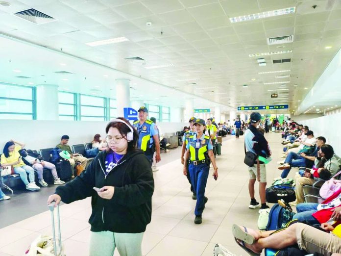 airfares_compressed_resized The Civil Aeronautics Board sets the fuel surcharge for September 1 to 15, 2026 at Level 13, up from Level 12 for the August 16 to 31, 2026 period. Photo shows passengers at the pre-departure domestic area of the Ninoy Aquino International Airport Terminal 3. AVSEU NCR NT3PS/FACEBOOK PHOTO