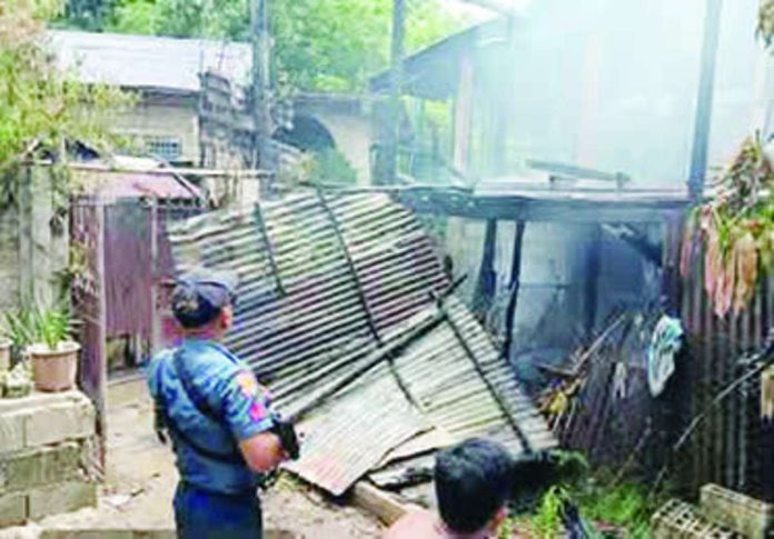 Officers of the President Roxas Municipal Police Station responds to the scene of a fire that destroyed a two-story house and damaged an adjacent home in Sitio Dupaks, Barangay Poblacion, President Roxas, Capiz, on Wednesday afternoon, August 19, 2026. PHOTO COURTESY OF DYVR RMN ROXAS 657 KHZ/FACEBOOK