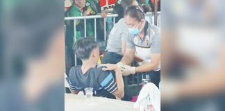 A member of the City Disaster Risk Reduction and Management Office (CDRRMO) administered first aid to one of the 11 individuals injured after an aerial firework allegedly malfunctioned and exploded on the ground during the Kabuganaan Festival fireworks display in Kabankalan City, Negros Occidental, on August 2. SCREENGRAB FROM BUNZO TV VLOG