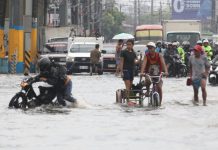 Palace mulls bigger culverts, drainage upgrades vs floods A rider pushes his motorcycle through flooded Aguinaldo Highway in Bacoor, Cavite in this photo taken on August 9, 2026. Continuous monsoon rains inundated several areas in Luzon early this August. PNA