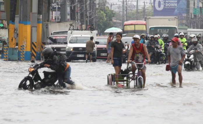 flood A rider pushes his motorcycle through flooded Aguinaldo Highway in Bacoor, Cavite in this photo taken on August 9, 2026. Continuous monsoon rains inundated several areas in Luzon early this August. PNA