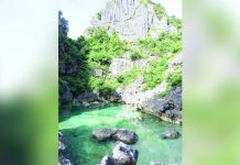 Known for its naturally enclosed saltwater pool surrounded by towering limestone formations, the Tangke “Saltwater” Lagoon is among the flagship ecotourism attractions of the Gigantes Group of Islands in Carles, Iloilo. PHOTO BY CARLES TOURISM OFFICIAL FACEBOOK PAGE