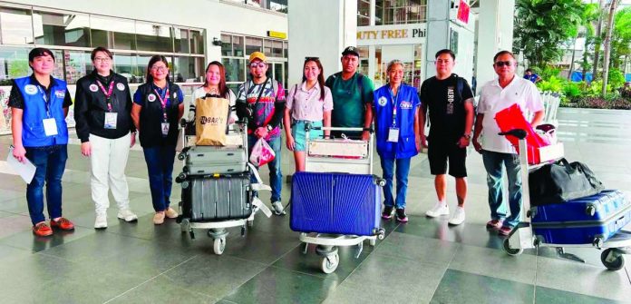 ime_3_Ilonggo_copy_compressed_resized HOME SAFE. Three Ilonggo seafarers who survived the July 18, 2026 Russian drone attack on the M/V Inase in the Black Sea arrive at the Iloilo International Airport in Cabatuan, Iloilo on Wednesday, Aug. 5, where they are welcomed by government officials and their families following their successful repatriation from the conflict-hit region. PESO – ILOILO PROVINCE