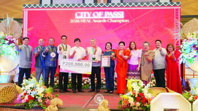 ime_LGU_hospitals_copy_compressed_resized TOP HEALTH HONORS. Passi City’s Mayor Stephen Palmares (6th from left) and the city's health personnel display the championship trophy and the ₱200,000 cash incentive after Passi City was named the 2026 Health Excellence and Leadership (HEAL) Awards Champion during the awarding ceremony of the Iloilo Provincial Health Office on July 30. The city topped the annual competition recognizing local government units for excellence in health service delivery and implementation of Universal Health Care in Iloilo Province. PHOTO COURTESY OF BALITA HALIN SA KAPITOLYO