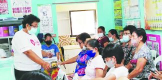 FRONTLINE FORCE. Barangay health workers attend a meeting led by their provincial federation president Violeta Gicana (standing) at a local health station in Guimbal, Iloilo. More than 11,800 BHWs across the province stand to receive monthly benefits, hazard pay and other assistance under the Senate-approved Magna Carta of Barangay Health Workers. PHOTO COURTESY OF VIOLETA GICANA