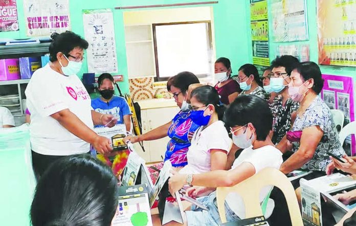 ime_barangay_health_workers_copy_compressed_resized FRONTLINE FORCE. Barangay health workers attend a meeting led by their provincial federation president Violeta Gicana (standing) at a local health station in Guimbal, Iloilo. More than 11,800 BHWs across the province stand to receive monthly benefits, hazard pay and other assistance under the Senate-approved Magna Carta of Barangay Health Workers. PHOTO COURTESY OF VIOLETA GICANA