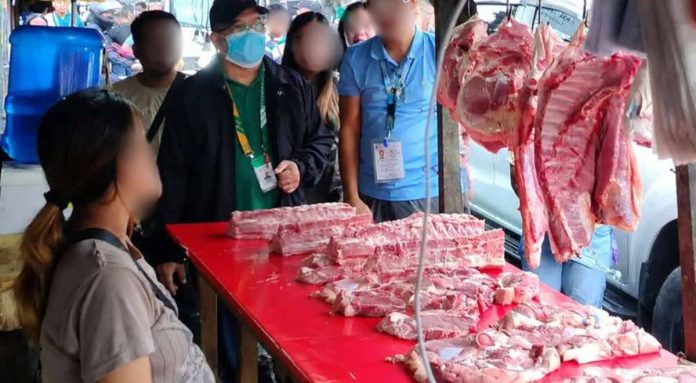 ime_meat2_compressed_resized MARKET INSPECTION. Personnel of the National Meat Inspection Service (NMIS) Region 6 conduct a meat safety inspection at a public market to verify that meat products being sold are properly inspected, fit for human consumption, and compliant with food safety regulations under the agency's #SafeMeatForAll campaign.