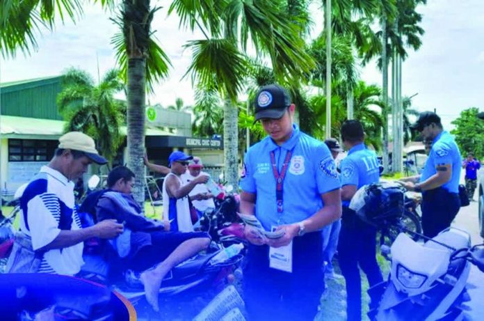 Land Transportation Office’s Region 6 personnel inspect motorists’ documents during a traffic enforcement operation in Calinog, Iloilo, as part of a road safety campaign that resulted in the issuance of 248 Temporary Operator's Permits to drivers found violating traffic and transportation laws. The operation also included public education efforts promoting responsible driving and compliance with road regulations. LTO-6