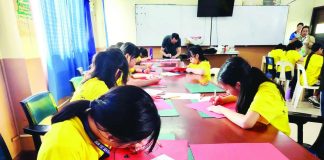 CULTURE IN EVERY CUT. Students of Sun Yat Sen High School in Iloilo City try their hand at traditional Chinese paper cutting as part of the school’s Chinese Culture Camp, which combines Mandarin learning with hands-on activities designed to deepen appreciation of Chinese culture and traditions. NELJOY GALIGAO/PN