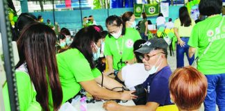 Department of Health medical personnel check residents’ blood pressure during a community outreach activity in Iloilo City aimed at promoting early disease detection and encouraging residents to seek timely medical care. DOH-6