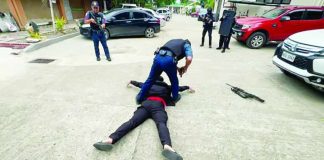 PINNED TO THE GROUND. A policeman immobilizes and disarms an “active shooter” at the Department of Education - Region 6 compound in Iloilo City during a full-scale Active Shooter Incident Awareness, Response, and Simulation Exercise. The drill tested coordinated law enforcement, medical, and evacuation procedures to strengthen preparedness for potential active shooter incidents in schools and government workplaces. DEPARTMENT OF EDUCATION – REGION 6