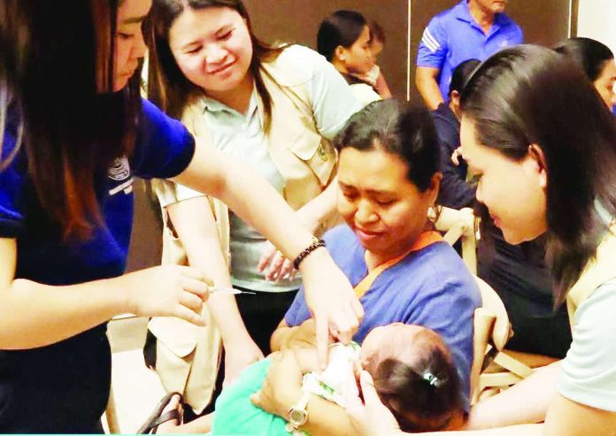 neljoy_race_vax_copy_compressed_resized Health workers administer a measles-rubella vaccine to a young child as part of the Department of Health’s Supplemental Immunization Activity in Western Visayas. As of Aug. 17, 2026, 149,021 children in the region had been vaccinated. Health authorities urge parents to have eligible children immunized before the campaign ends on Aug. 28, 2026. DOH-WESTERN VISAYAS PHOTO