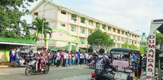 Students of Dumangas National High School in Dumangas, Iloilo gather outside their campus after the suspension of their classes due to the threatening social media posts of a teacher. PHOTO BY DUMANGAS ANG BANWA KO