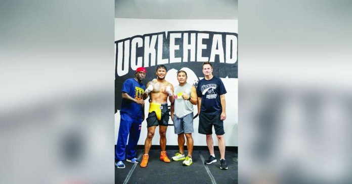 sports Marcial_compressed_superimposed Filipino middleweight Eumir Felix Marcial (second from left) poses with American trainer Kaye Koroma, coach Reynaldo Galido and international boxing dealmaker Sean Gibbons ahead of Marcial’s Sept. 19 showdown with Omar Ulises Huerta in San Diego, California. CONTRIBUTED PHOTO