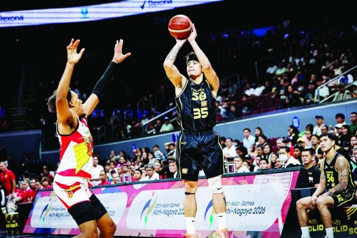 sports_Aurin_compressed_resized Clutch from deep: TNT Tropang 5G's Kim Aurin rises for a three-point shot during the Tropang 5G's 93-89 overtime victory over San Miguel Beer in the PBA Season 50 Governors' Cup at the SM Mall of Asia Arena in Pasay City on Saturday night. PBA PHOTO