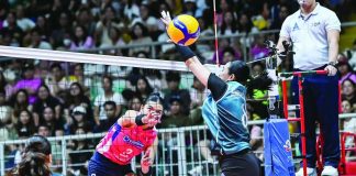 Creamline Cool Smashers’ Alyssa Valdez scores against Ilongga Aiza Maizo-Pontillas of Galeries Tower Highrisers during their PVL On Tour match at the Victorias City Coliseum in Negros Occidental. PVL PHOTO