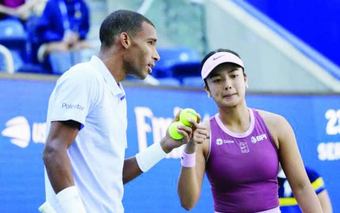 sports_Eala_compressed_resized Alexandra Eala talks to mixed doubles partner Felix Auger-Aliassime during their US Open match. REUTERS