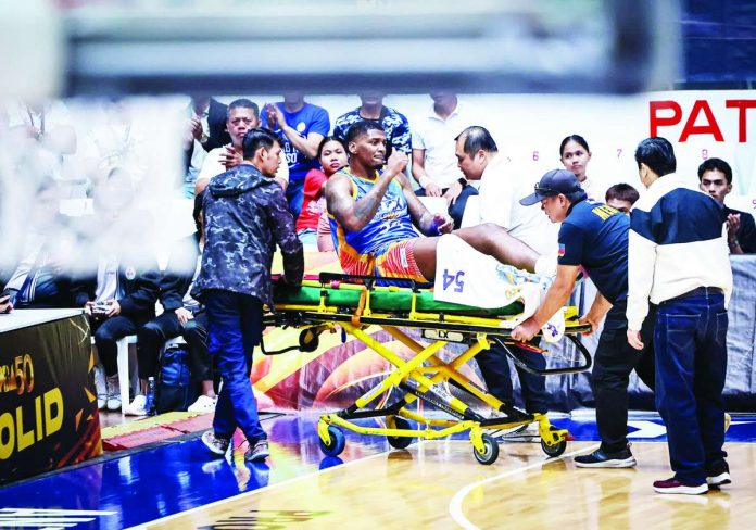 sports_Gonza_compressed_resized NLEX Road Warriors import DeQuan Jones is stretchered out after suffering a severe lower-leg eversion following a collision with TNT center Brandon Ganuelas-Rosser during their PBA Governors’ Cup game at the Ynares Center in Antipolo City. PBA PHOTO
