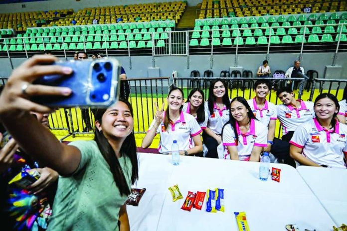 sports_Jaja_compressed_resized Negrense volleyball fans take a selfie with Jaja Santiago and members of the Creamline Cool Smashers ahead of the PVL On Tour finale in Victorias City, Negros Occidental. PVL