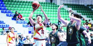 San Miguel Beermen’s John Michael Calma goes for an easy basket against the Macau Giant Pandas’ defense during their PBA Season 50 Governors’ Cup game at the Ynares Center in Montalban, Rizal. PBA PHOTO