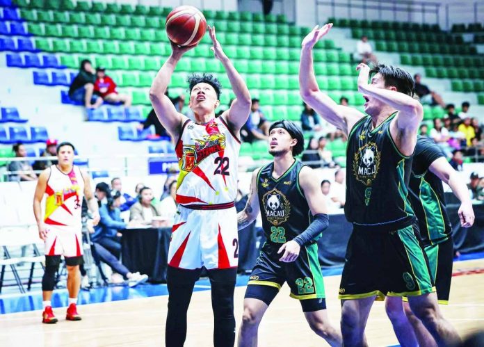 sports_PBA_compressed_resized San Miguel Beermen’s John Michael Calma goes for an easy basket against the Macau Giant Pandas’ defense during their PBA Season 50 Governors’ Cup game at the Ynares Center in Montalban, Rizal. PBA PHOTO