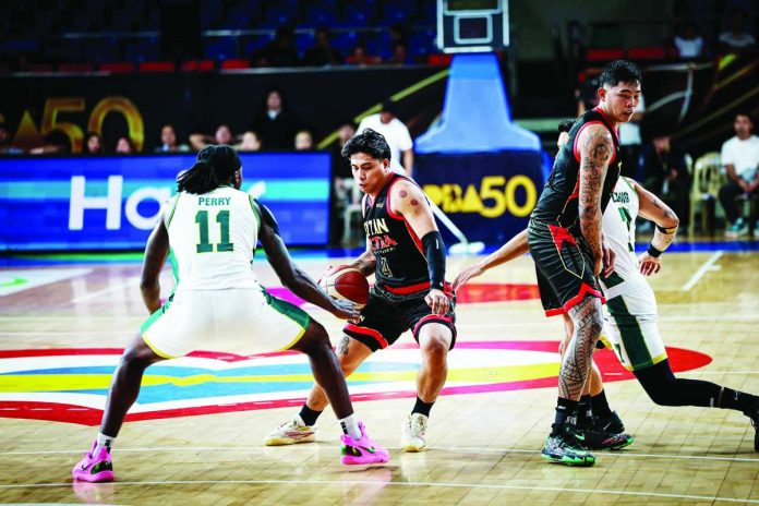sports_Titan_compressed_resized Ilonggo guard John Bryan Sajonia of Titan Ultra Giant Risers drives against the defense of Macau Giant Pandas import De'Vondre Perry during their PBA Season 50 Governors’ Cup clash at the Ninoy Aquino Stadium. PBA PHOTO