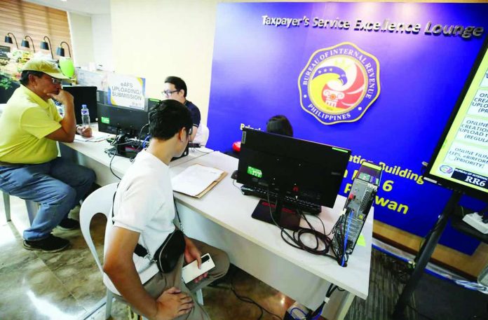 tax_hikes_compressed_resized Taxpayers file their Annual Income Tax Returns at the Taxpayer Excellence Lounge, Bureau of Internal Revenue office in Intramuros, Manila on May 15, 2026. INQUIRER PHOTO / NIÑO JESUS ORBETA