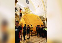 Emergency responders rescue a man who climbed onto the altar area of San Sebastian Cathedral in Bacolod City on September 26, 2026. Responders placed an inflatable jump cushion below the elevated area, where the man safely landed. BFP-BACOLOD PHOTO