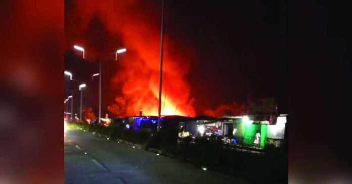 Bacolod fire copy_superimposed A fire damages several houses in Purok San Jose 2, Barangay Sum-ag, Bacolod City, late Tuesday night, September 1, displacing 18 families or 83 individuals. Nine houses were totally destroyed while five others were partially damaged. iFM PHOTO