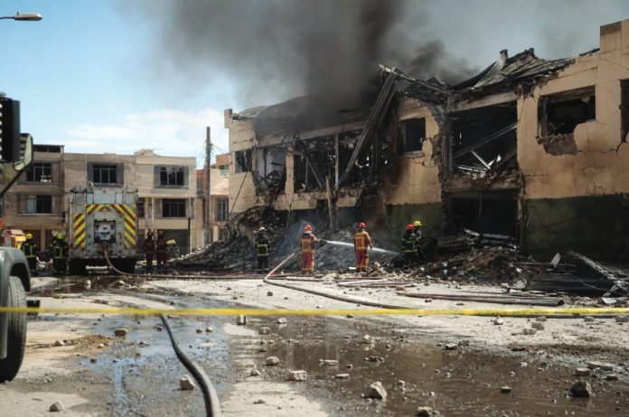 In the city of Viacha, Bolivia, at least 14 servicemen have still not been found after two explosions at a military base. Two young men in their first year of compulsory military service were killed in the incident, while more than 80 others were injured. CNN