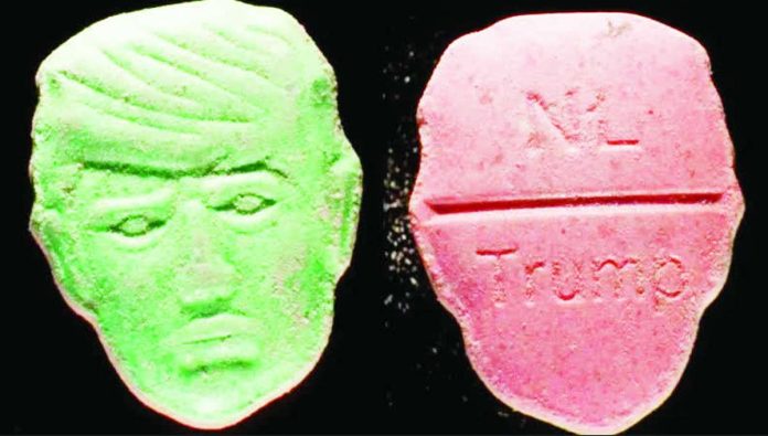 Dutch_compressed_resized Front and back picture of an ecstasy pill in the shape of United States President Donald Trump’s head. The front is a depiction of Trump's face carved into the pill; the back features the word “NL” carved at the top of a break line under which is stamped the word “Trump”. TRIMBOS INSTITUTE