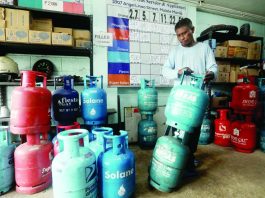 A worker prepares liquefied petroleum gas (LPG) tanks for delivery at a store in Paco, Manila. President Ferdinand R. Marcos Jr. has suspended the fuel excise tax on LPG and kerosene amid elevated fuel prices and their potential impact on consumers and the broader economy. PNA